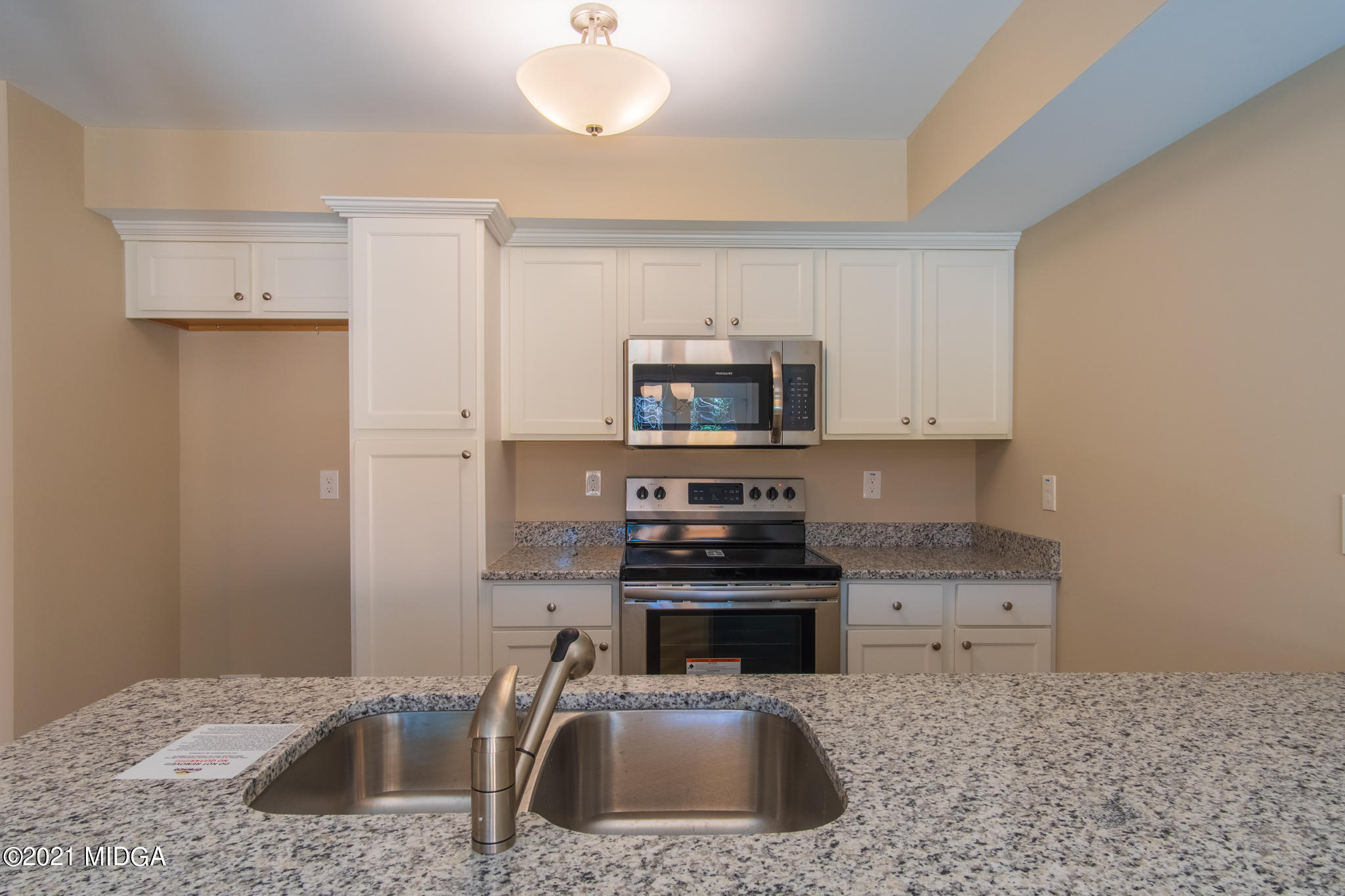 340 Pond View Road Macon, GA 31206 - Photo 6 of 22 a kitchen with stainless steel appliances a sink a stove a microwave a counter top space and cabinets
