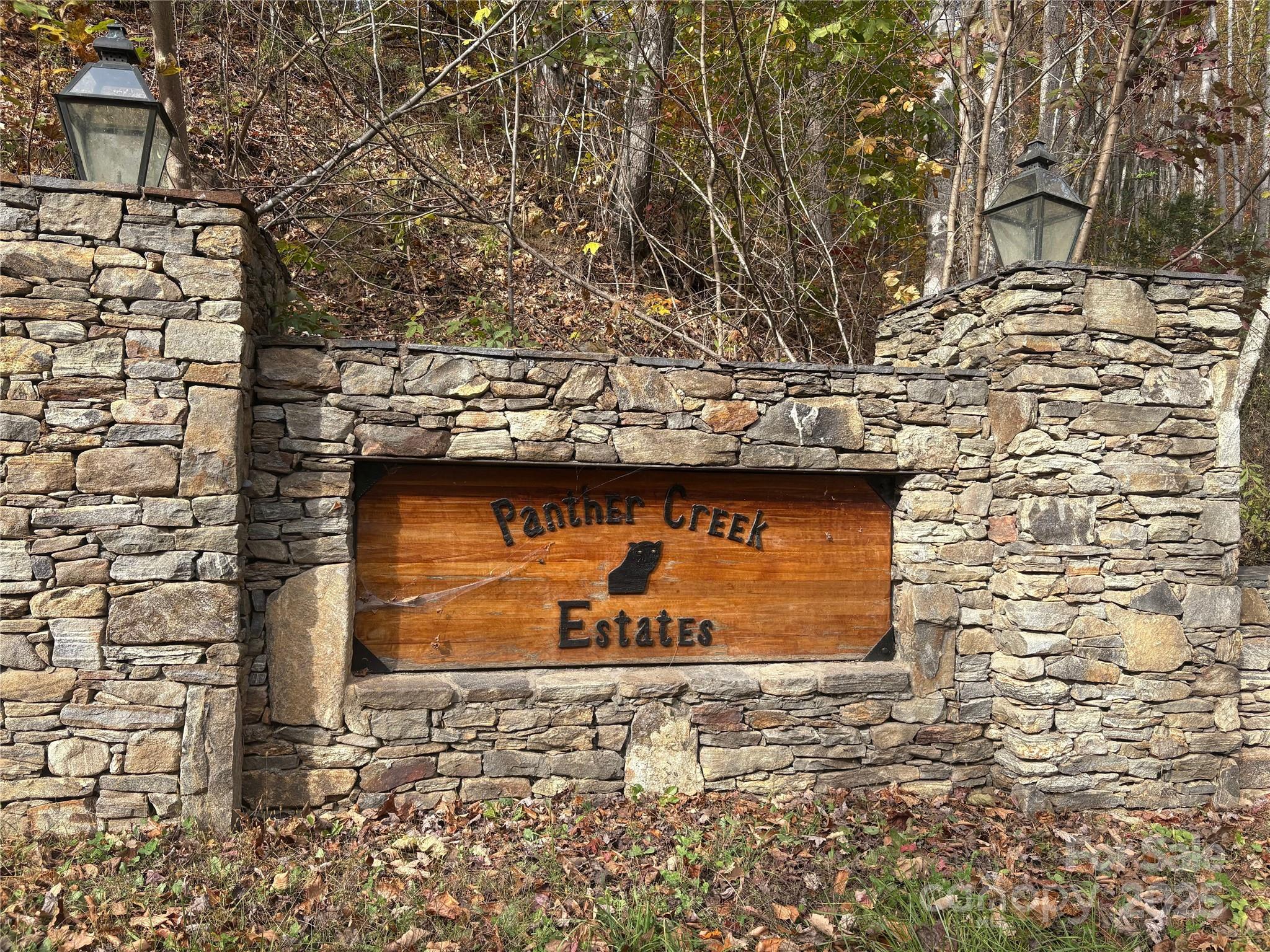 899 Hyacinth Drive Clyde, NC 28721 - Photo 28 of 29 a front view of a stone building