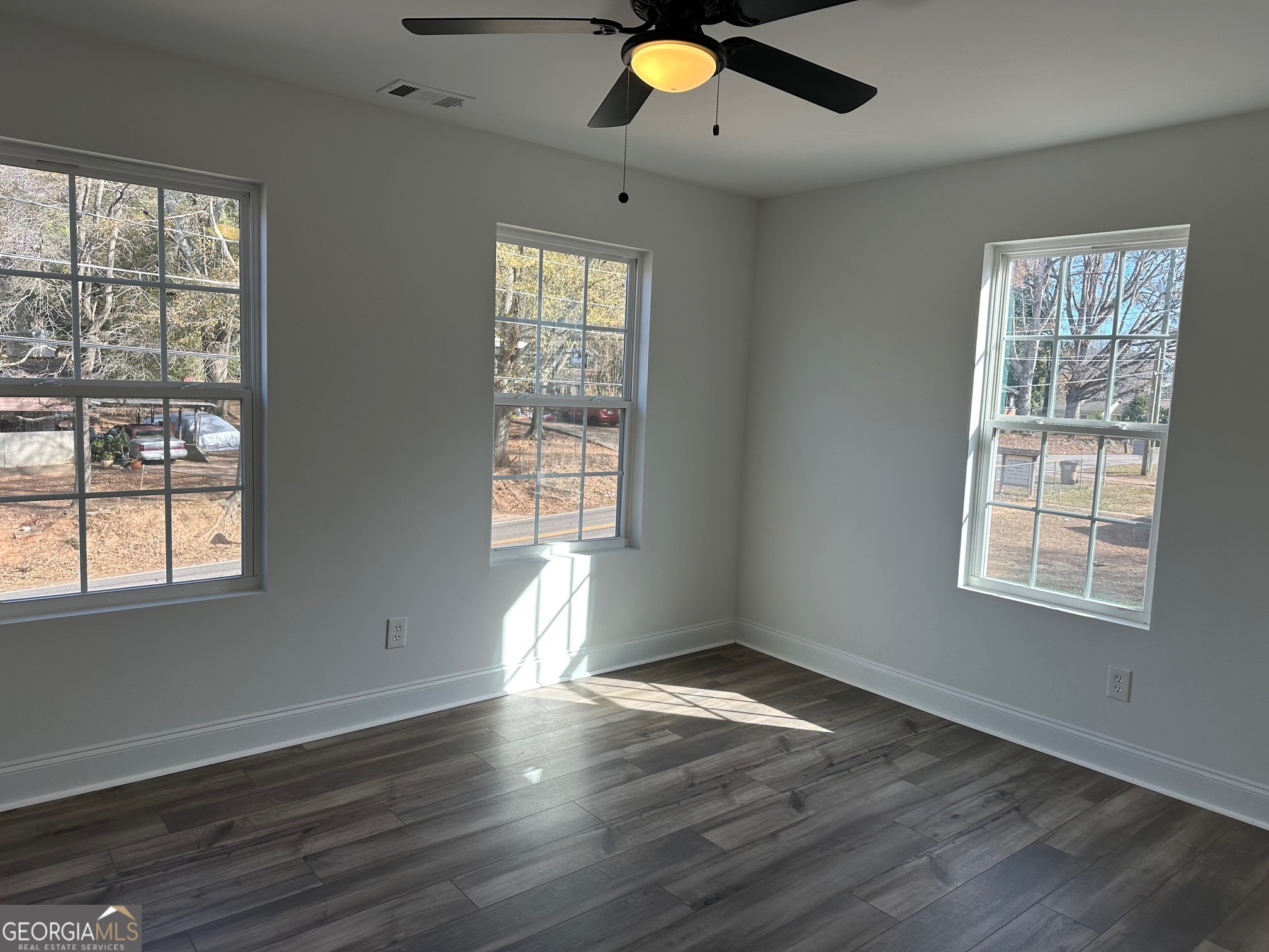 2147 Spring Road Gainesville, GA 30504 - Photo 12 of 44 an empty room with wooden floor and windows