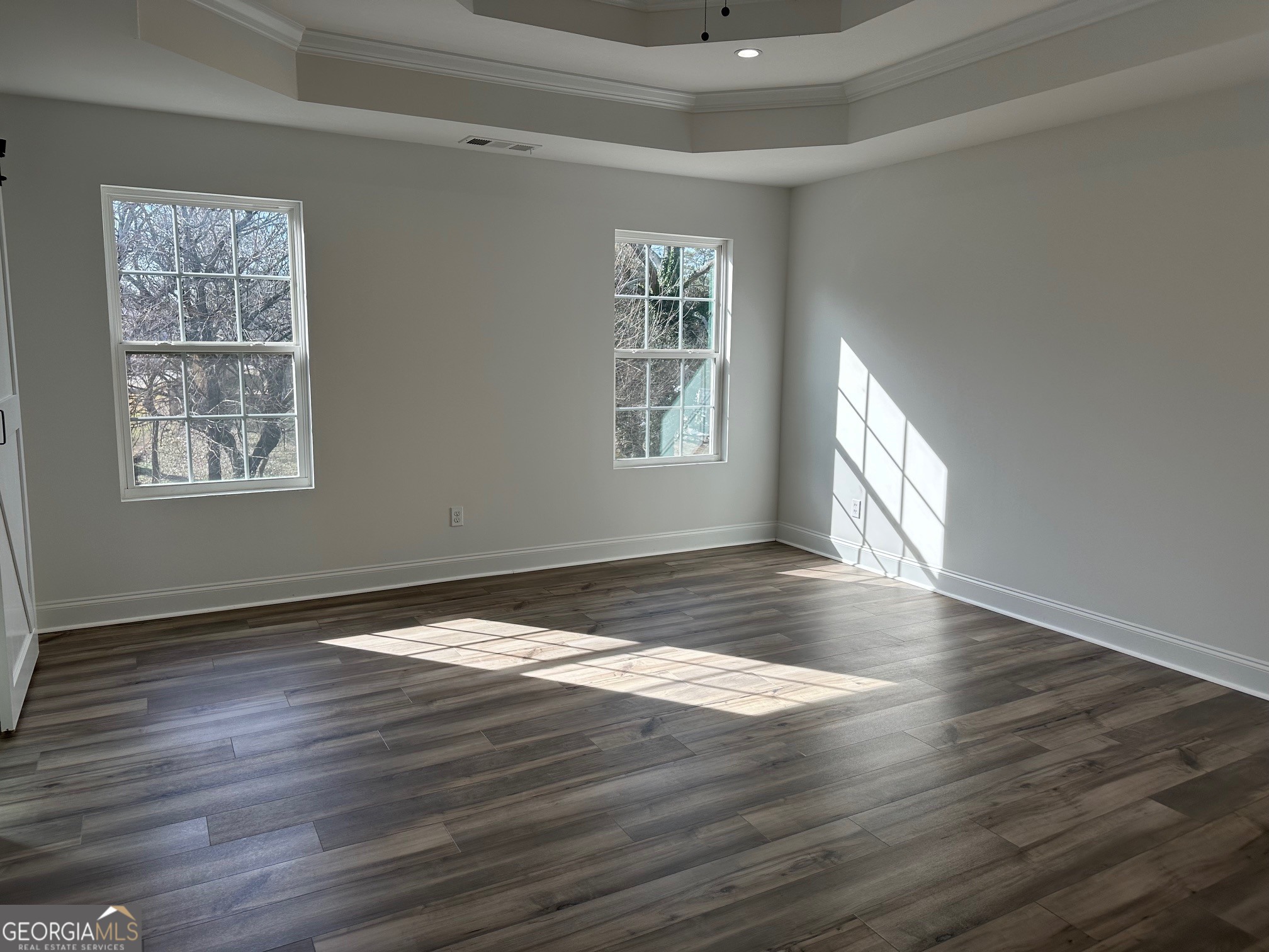 2147 Spring Road Gainesville, GA 30504 - Photo 14 of 44 a view of an empty room with wooden floor and a window