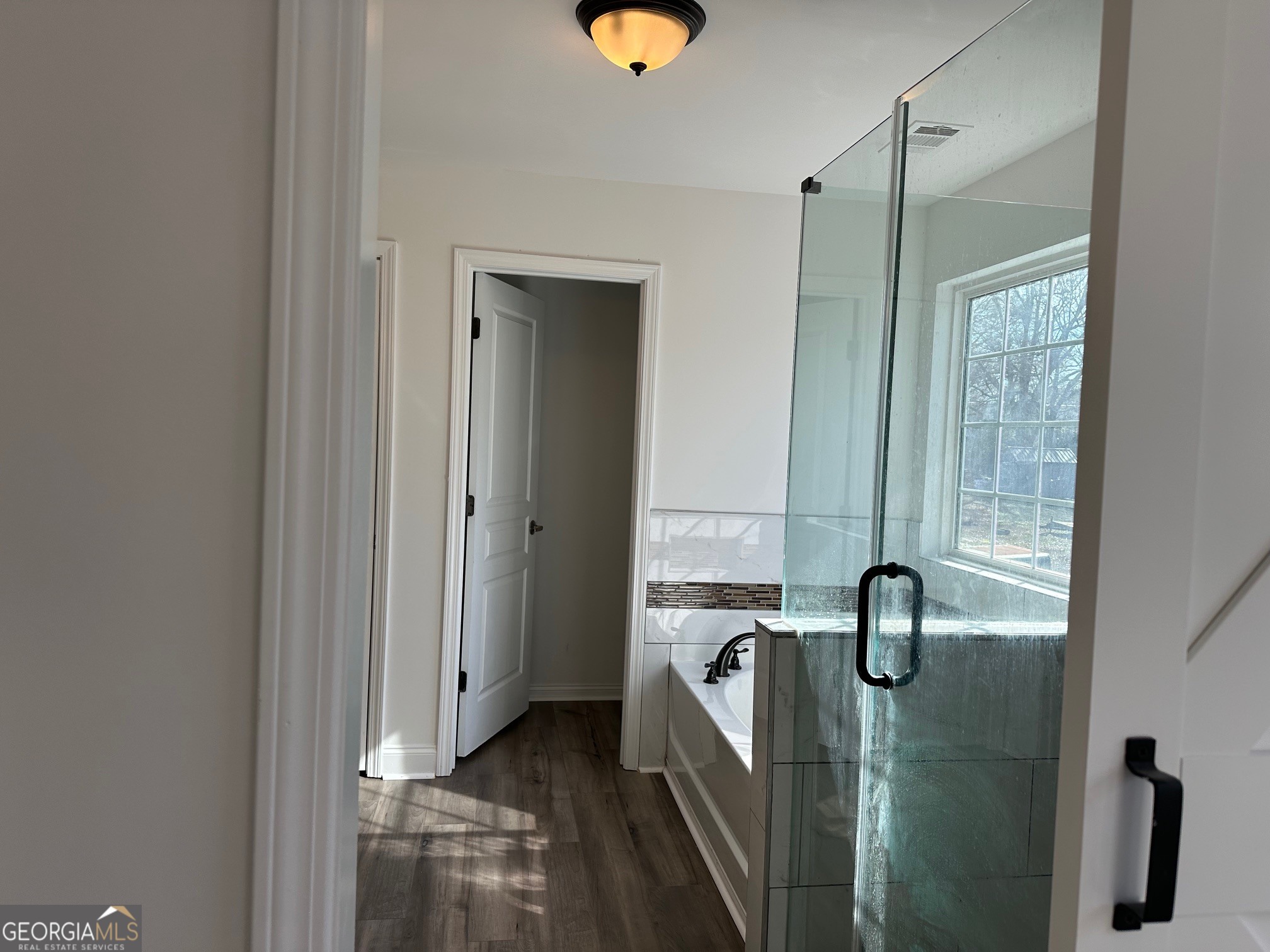 2147 Spring Road Gainesville, GA 30504 - Photo 17 of 44 a bathroom with a tub and shower
