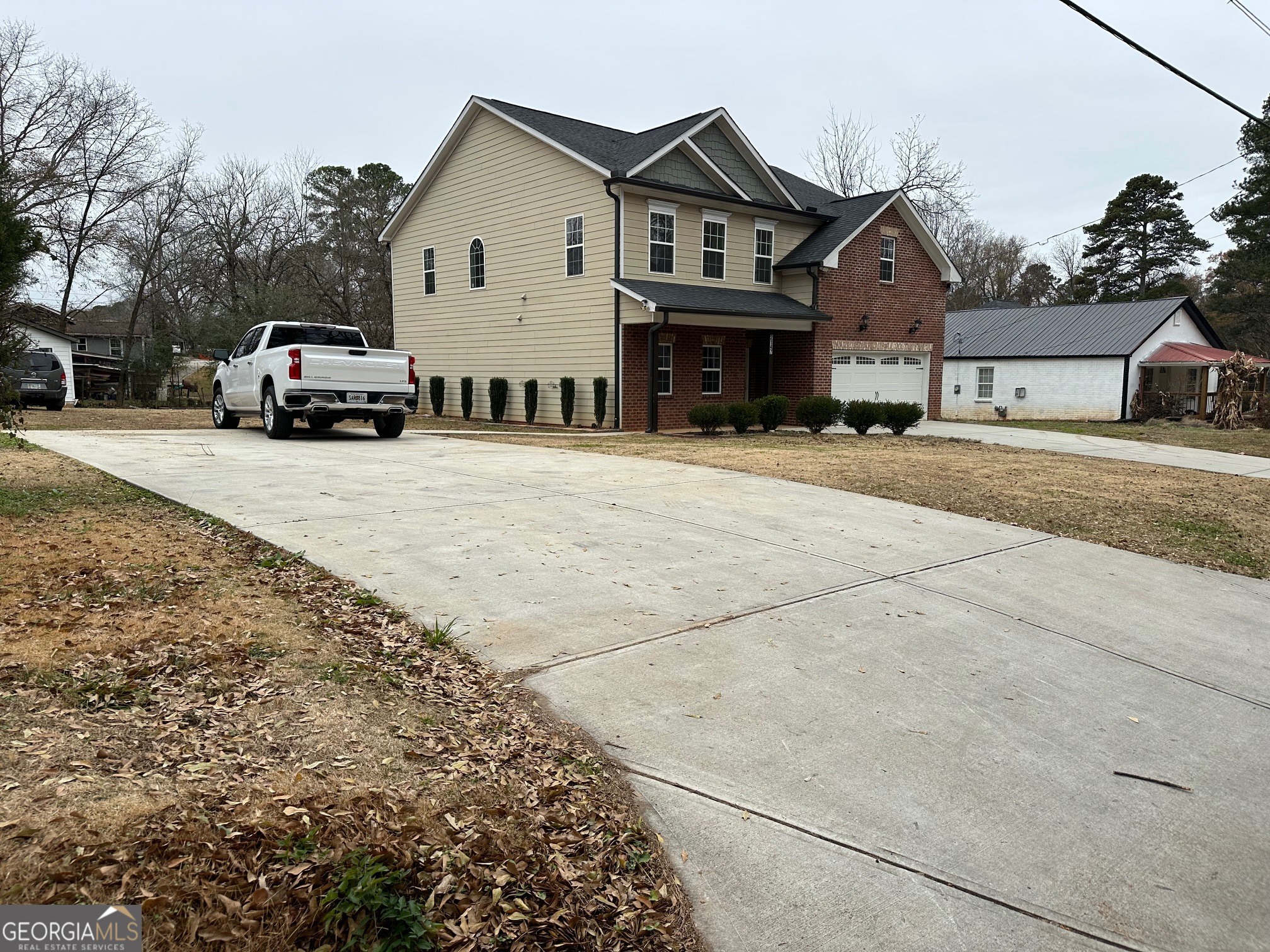 2147 Spring Road Gainesville, GA 30504 - Photo 40 of 44 a front view of a house with a yard