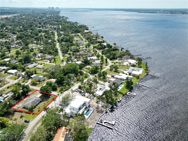 an aerial view of residential houses with city view