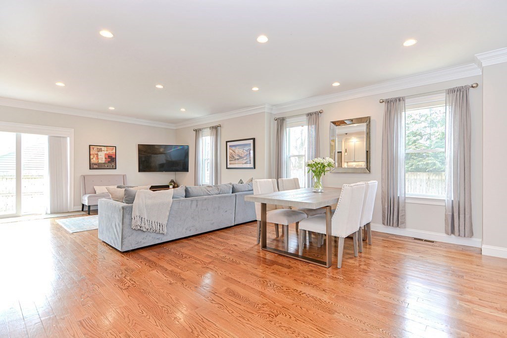 89 Walker Street, Unit 89 Newton, MA 02460 - Photo 13 of 42 a living room with furniture and a flat screen tv