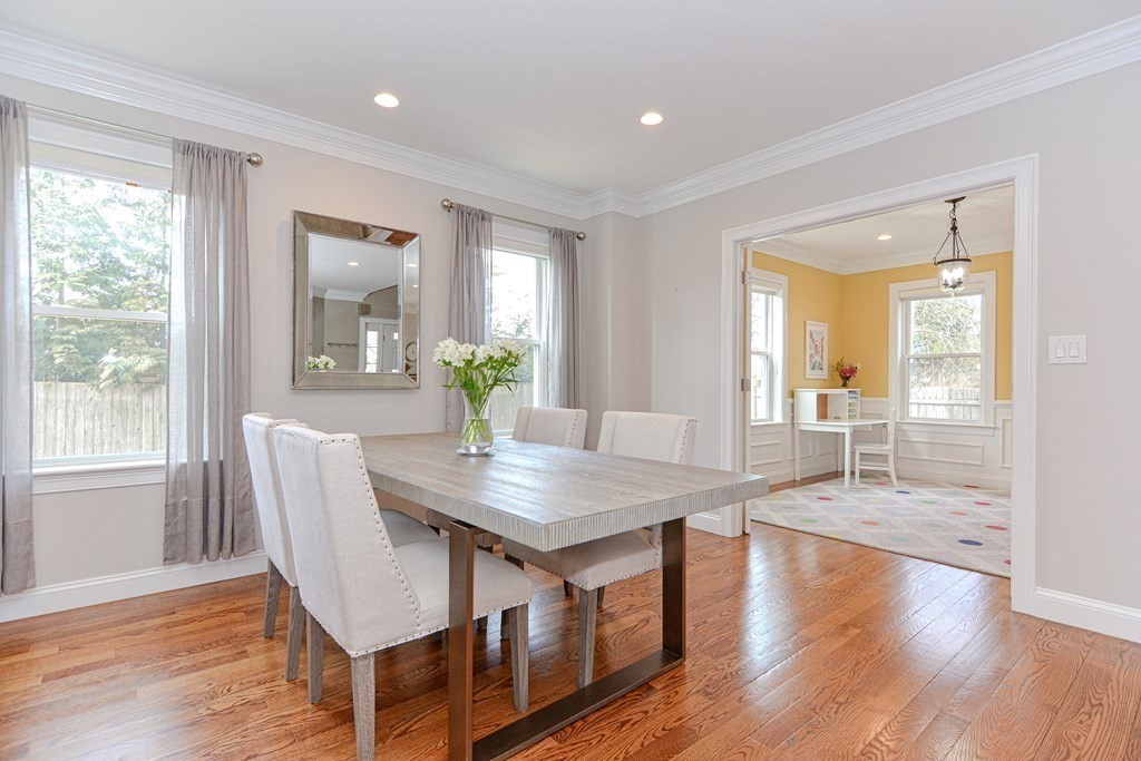 89 Walker Street, Unit 89 Newton, MA 02460 - Photo 14 of 42 a room with dining table and wooden floor