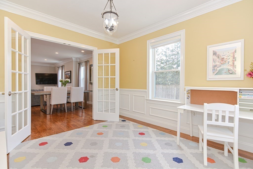 89 Walker Street, Unit 89 Newton, MA 02460 - Photo 15 of 42 a living room with furniture and a dining table with wooden floor