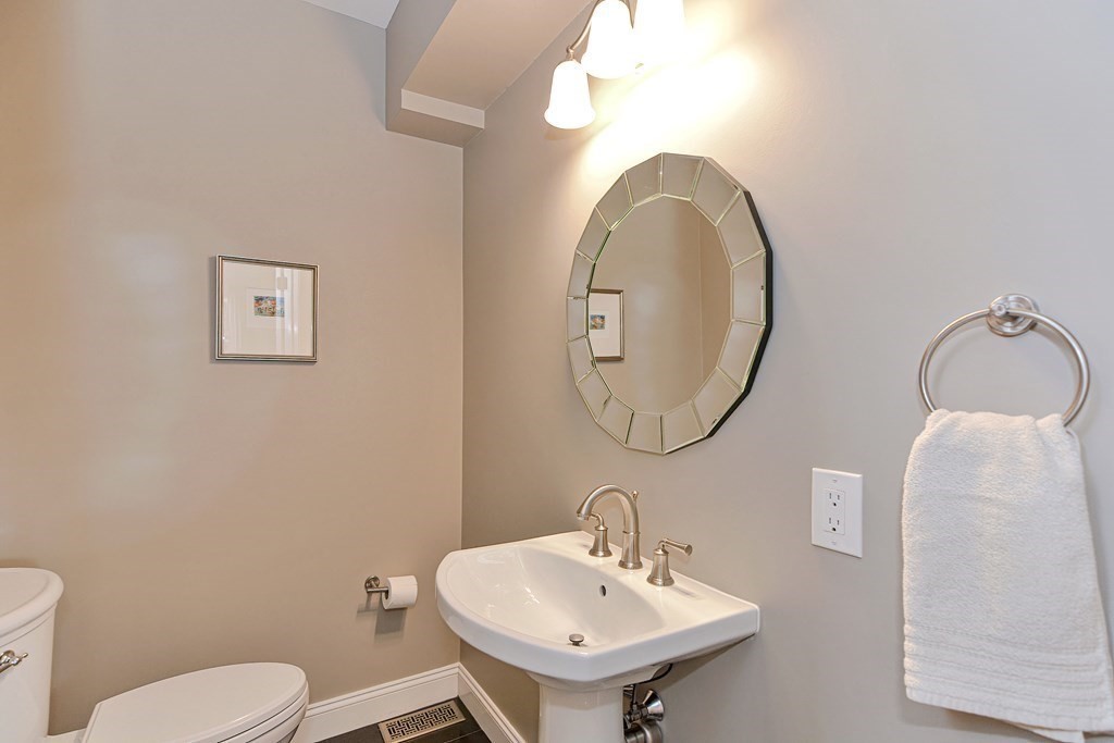 89 Walker Street, Unit 89 Newton, MA 02460 - Photo 17 of 42 a bathroom with a toilet sink and mirror