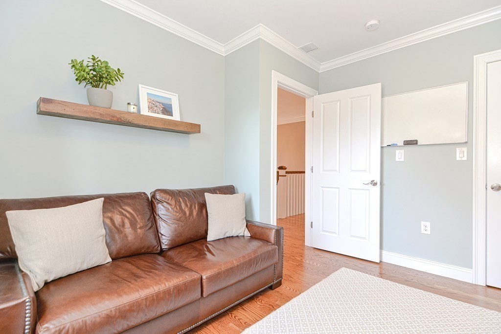 89 Walker Street, Unit 89 Newton, MA 02460 - Photo 25 of 42 a living room with furniture and a potted plant