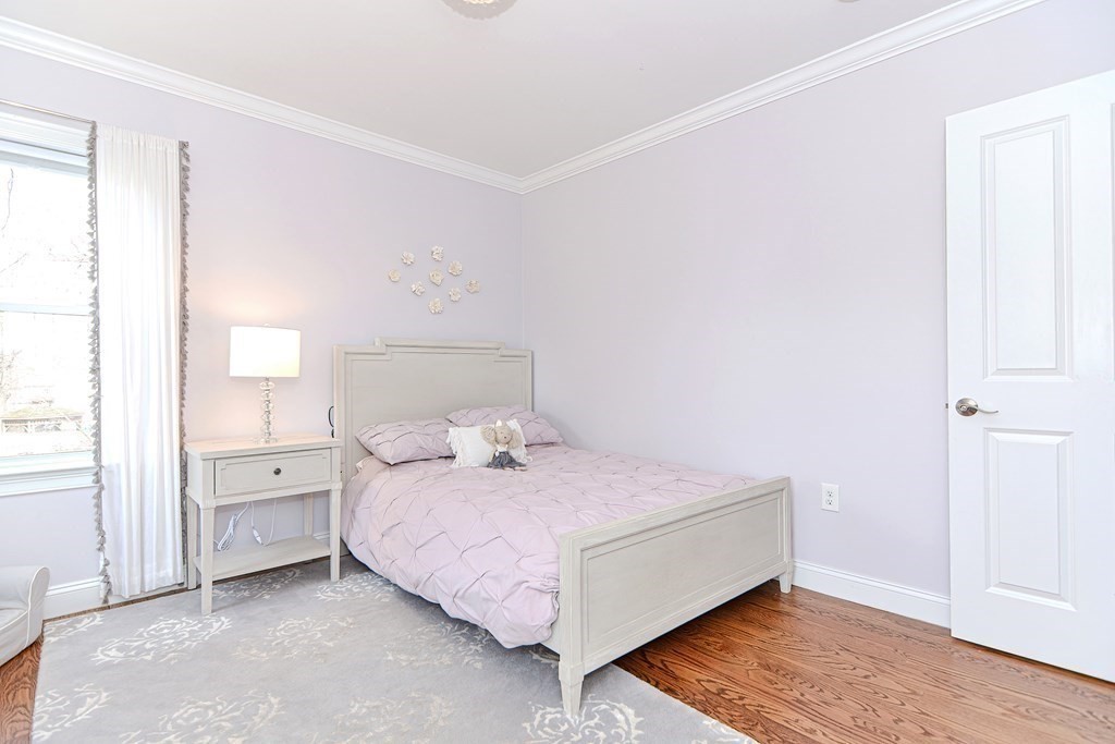 89 Walker Street, Unit 89 Newton, MA 02460 - Photo 26 of 42 a large bed sitting in a bedroom next to a window