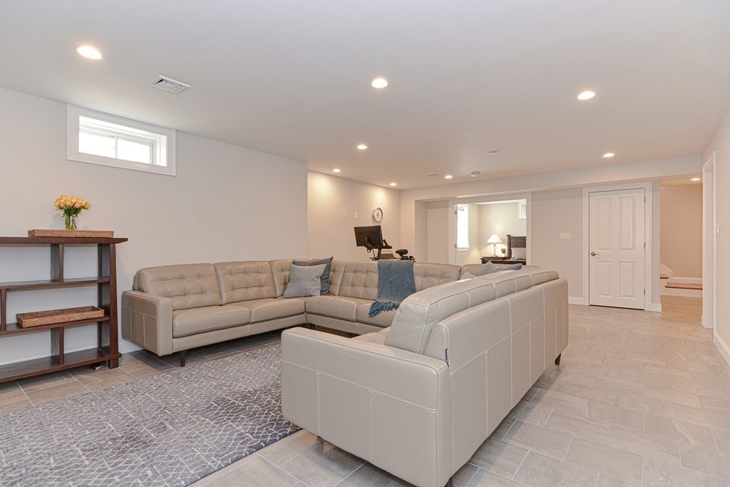 89 Walker Street, Unit 89 Newton, MA 02460 - Photo 29 of 42 a living room with furniture and a couch