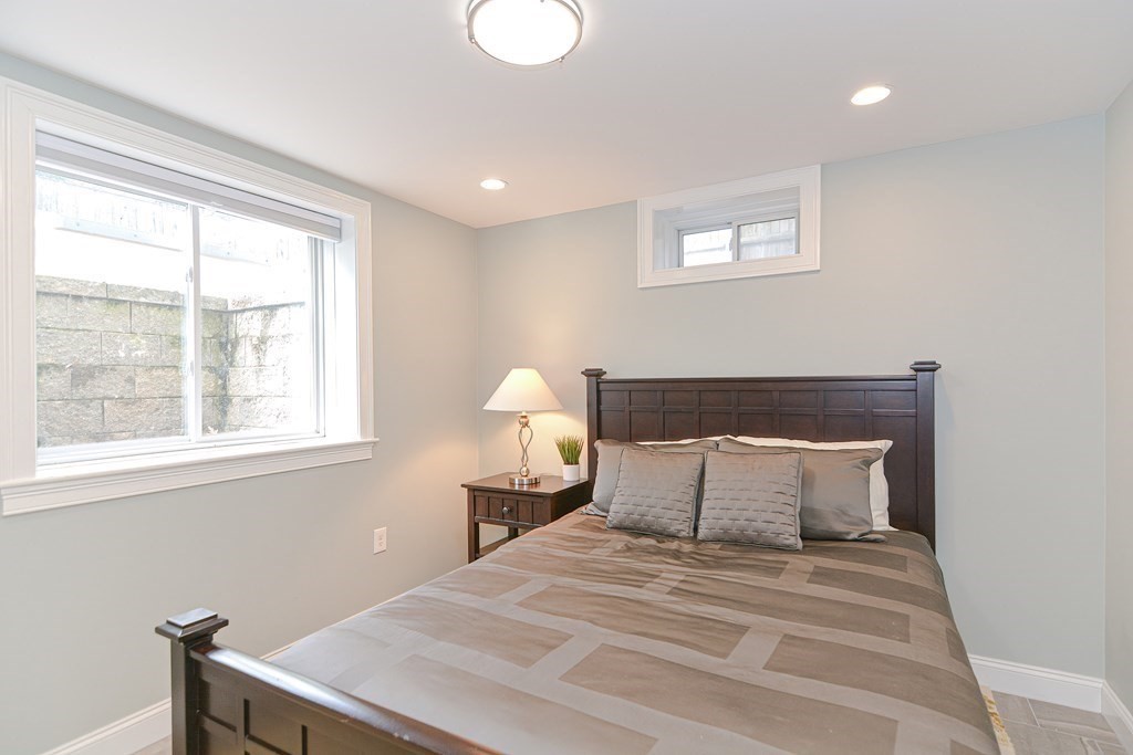 89 Walker Street, Unit 89 Newton, MA 02460 - Photo 31 of 42 a bedroom with a bed and a window