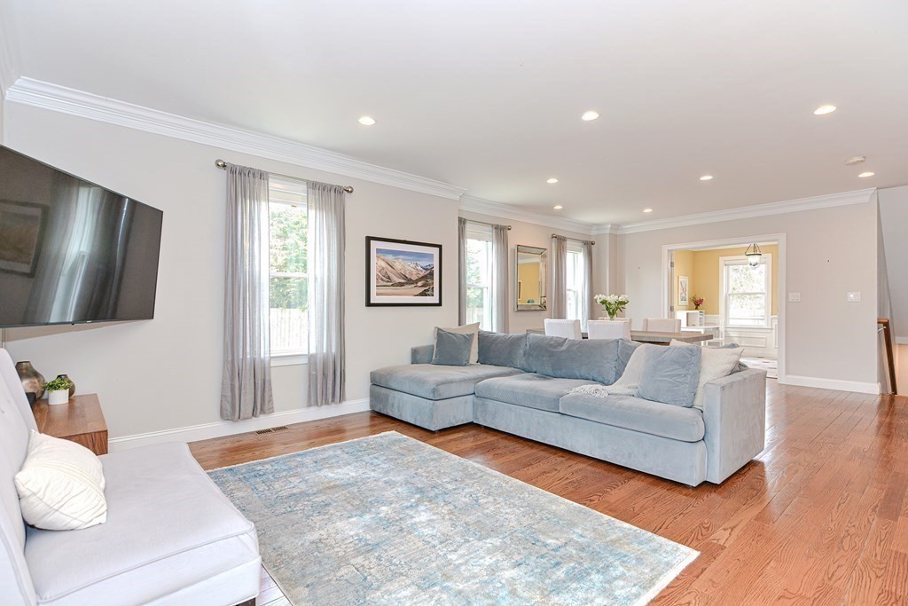 89 Walker Street, Unit 89 Newton, MA 02460 - Photo 4 of 42 a living room with furniture and a flat screen tv