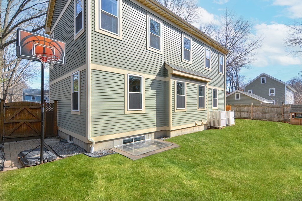 89 Walker Street, Unit 89 Newton, MA 02460 - Photo 41 of 42 a view of a house with a yard and sitting area