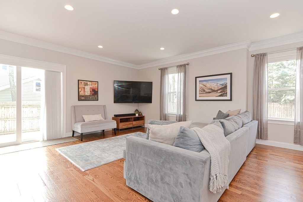 89 Walker Street, Unit 89 Newton, MA 02460 - Photo 5 of 42 a living room with furniture and a flat screen tv
