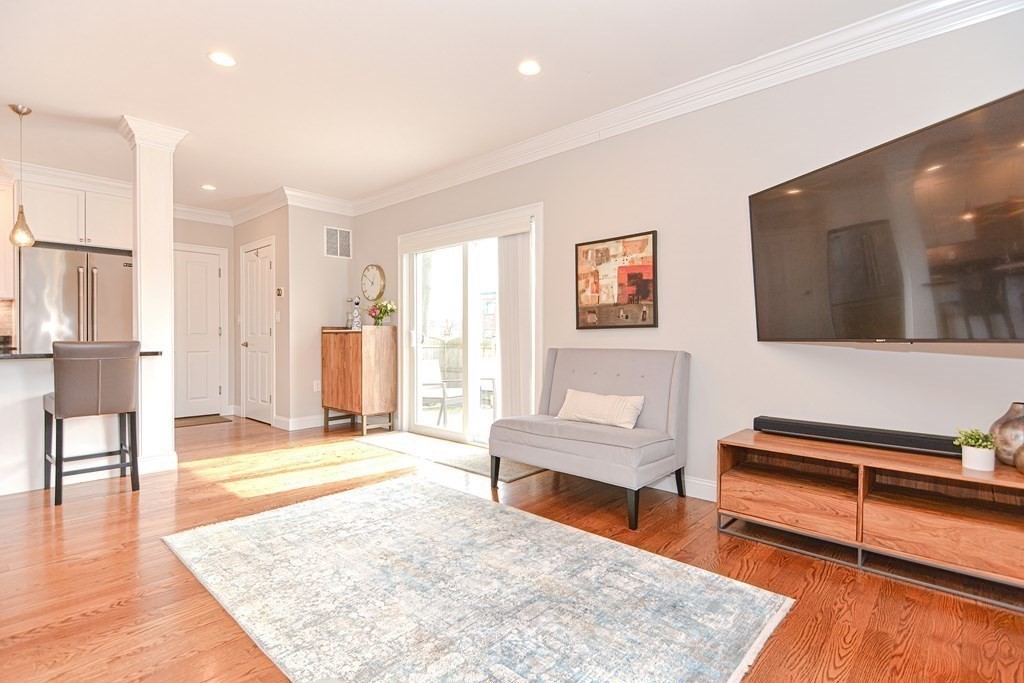 89 Walker Street, Unit 89 Newton, MA 02460 - Photo 7 of 42 a living room with furniture and a wooden floor