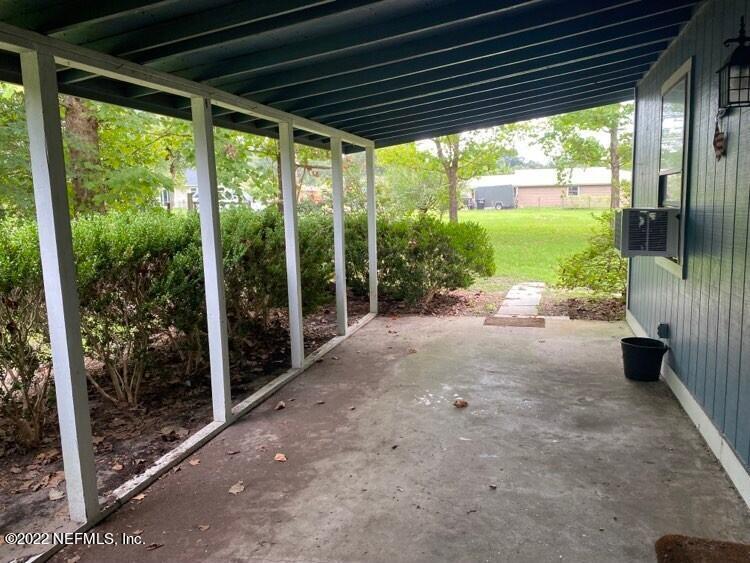 85152 Myrtice Road Yulee, FL 32097 - Photo 3 of 7 a view of a porch with porch and furniture