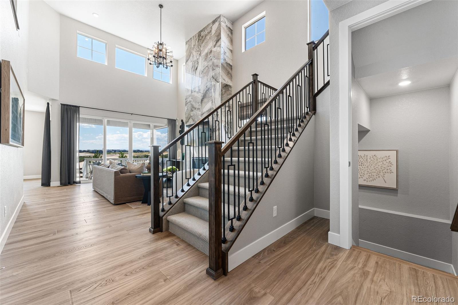 4261 Ridgewalk Point Castle Rock, CO 80108 - Photo 11 of 39 a view of entryway and hall with wooden floor