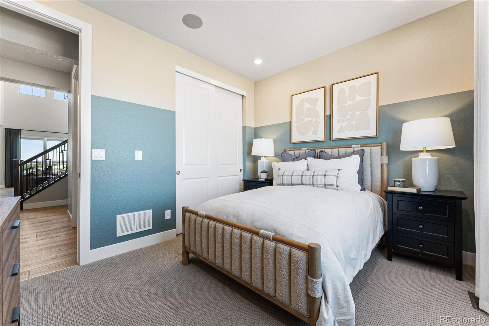 4261 Ridgewalk Point Castle Rock, CO 80108 - Photo 14 of 39 a bedroom with a bed and a lamp