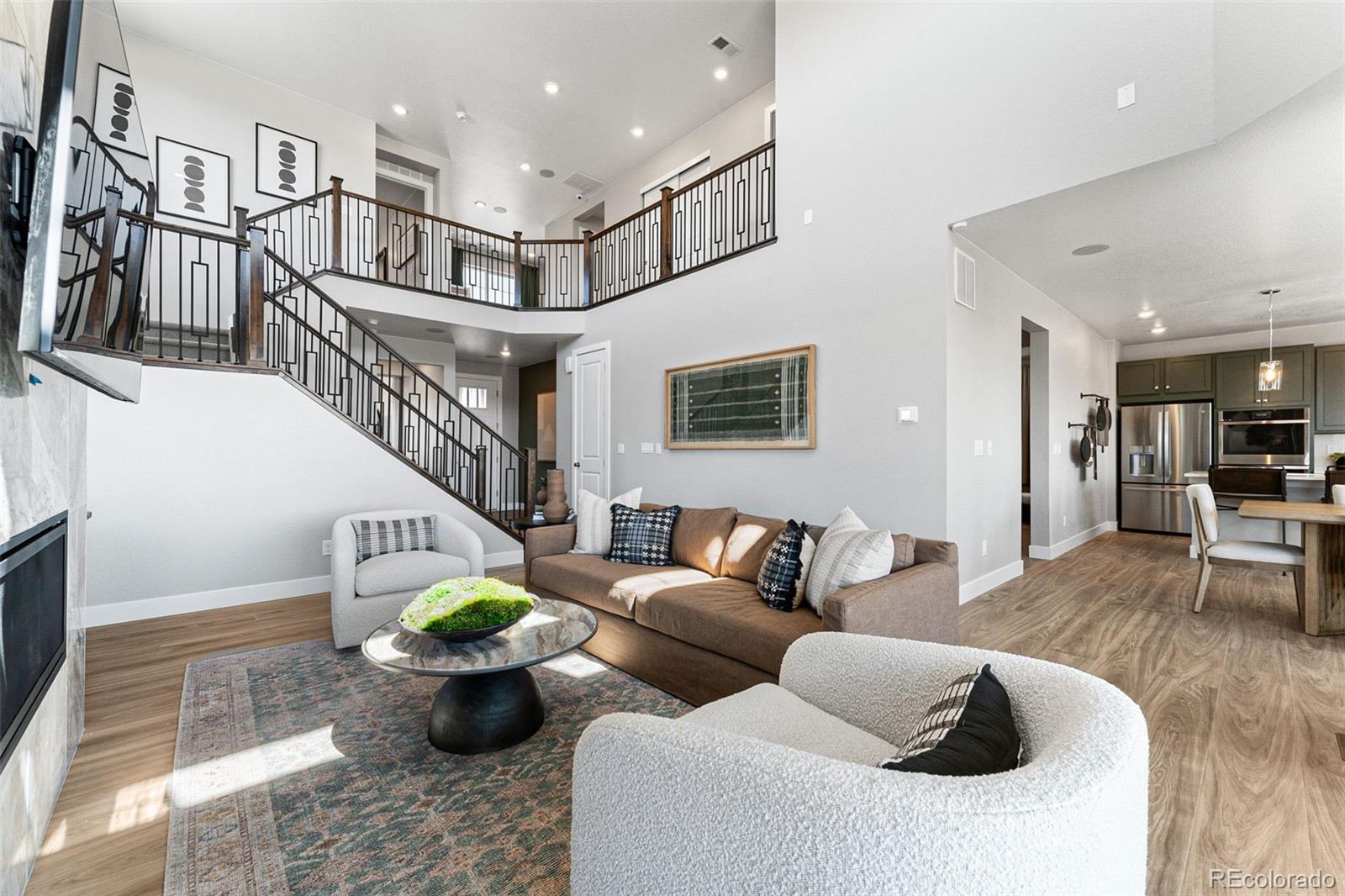 4261 Ridgewalk Point Castle Rock, CO 80108 - Photo 18 of 39 a living room with furniture potted plant and kitchen view