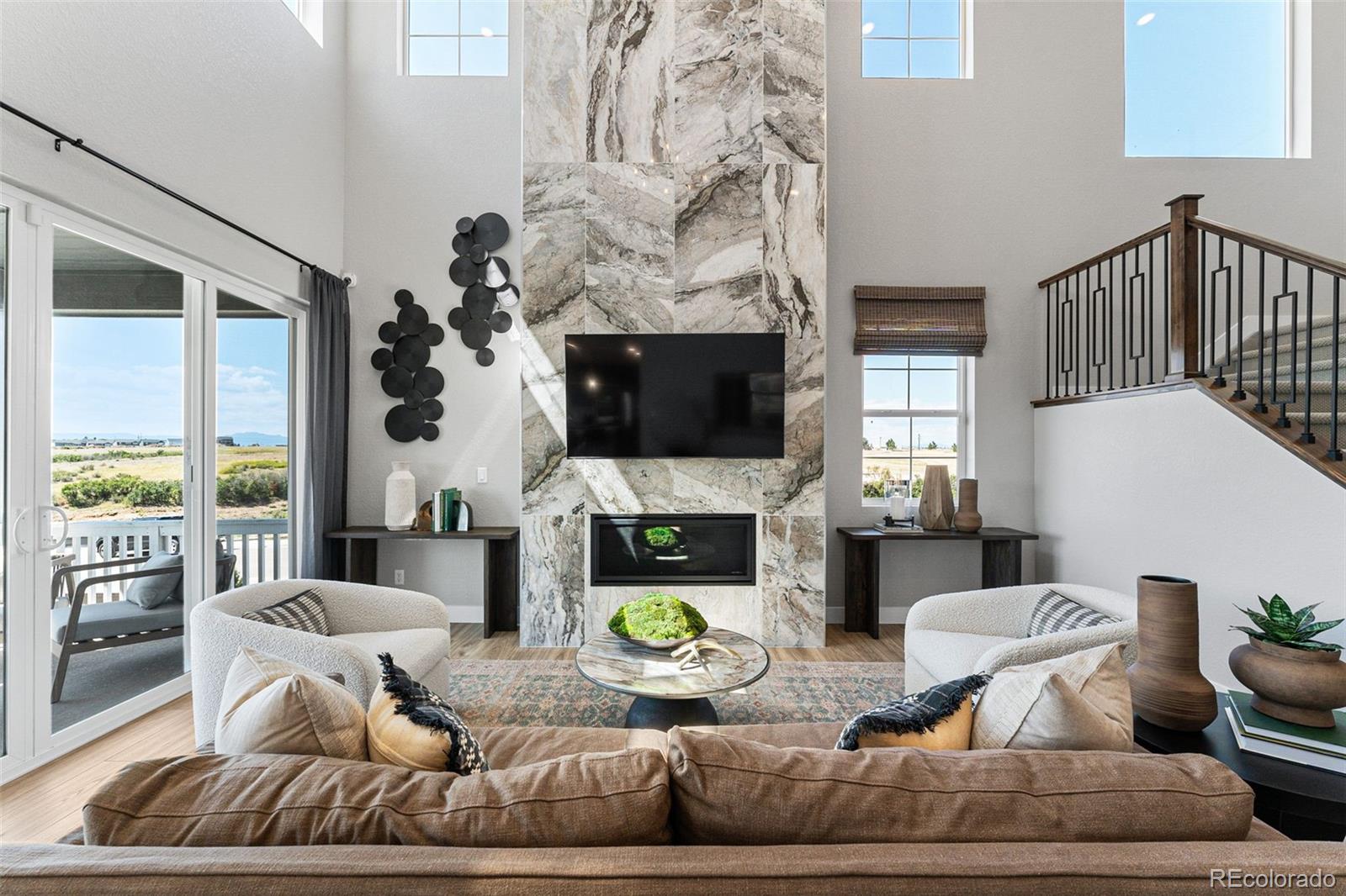 4261 Ridgewalk Point Castle Rock, CO 80108 - Photo 20 of 39 a living room with fireplace furniture and a fireplace