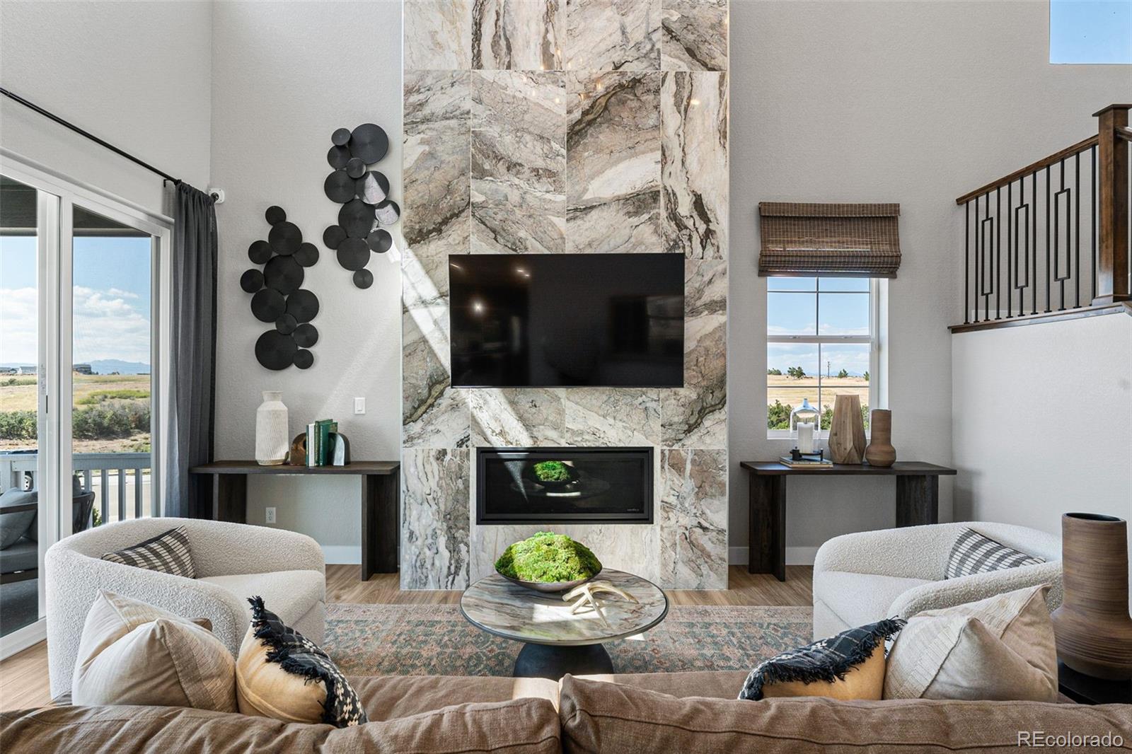 4261 Ridgewalk Point Castle Rock, CO 80108 - Photo 21 of 39 a living room with furniture and a fireplace