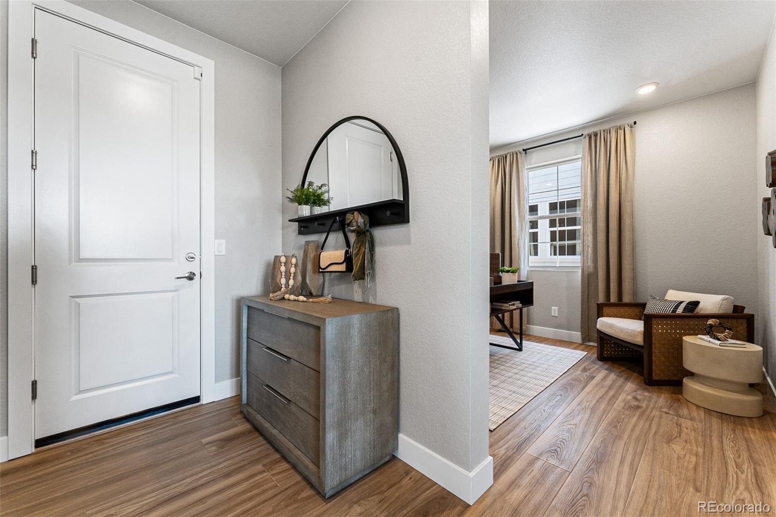 4261 Ridgewalk Point Castle Rock, CO 80108 - Photo 34 of 39 a view of living room with furniture and wooden floor