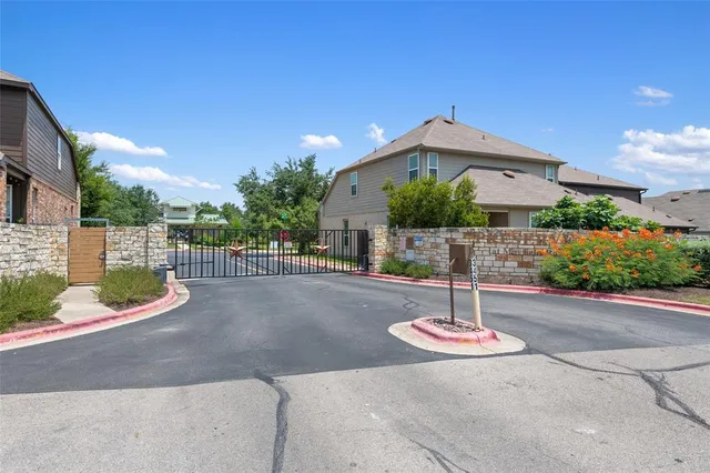 an aerial view of a houses with yard