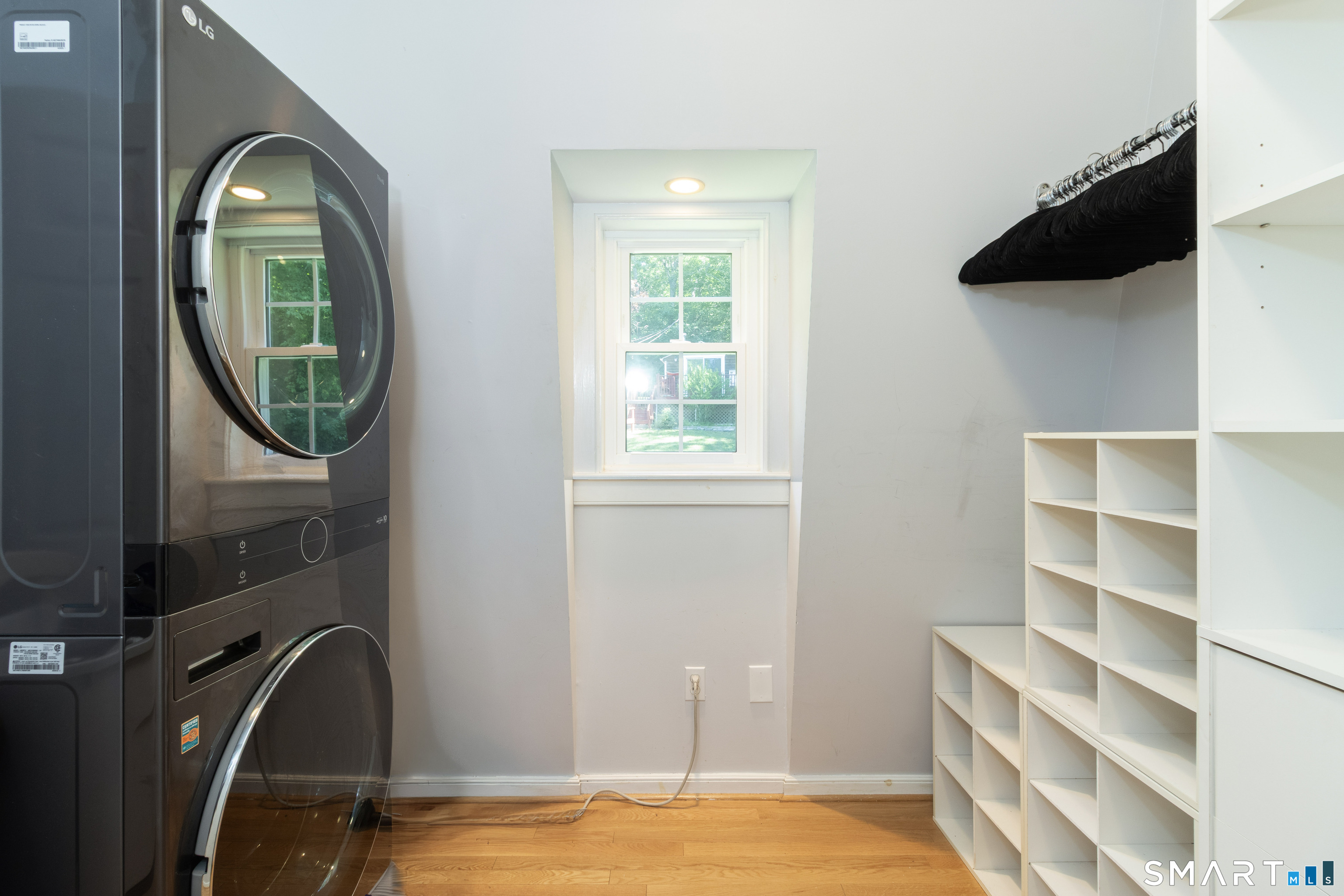 80 River Road Clinton, CT 06413 - Photo 13 of 18 The walk-in closet and Laundry area.