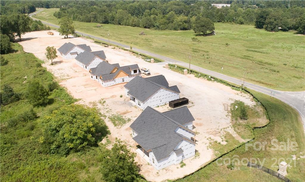 2105 State Rd S-46-1474, Unit 1 Clover, SC 29710 - Photo 23 of 31 a view of a swimming pool with a yard