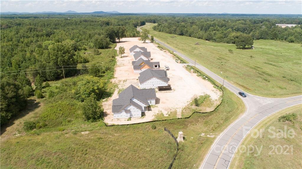 2105 State Rd S-46-1474, Unit 1 Clover, SC 29710 - Photo 25 of 31 a view of a swimming pool with a yard