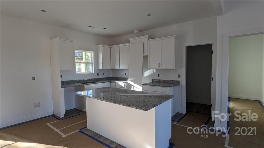 2105 State Rd S-46-1474, Unit 1 Clover, SC 29710 - Photo 8 of 31 a kitchen with a sink and a refrigerator