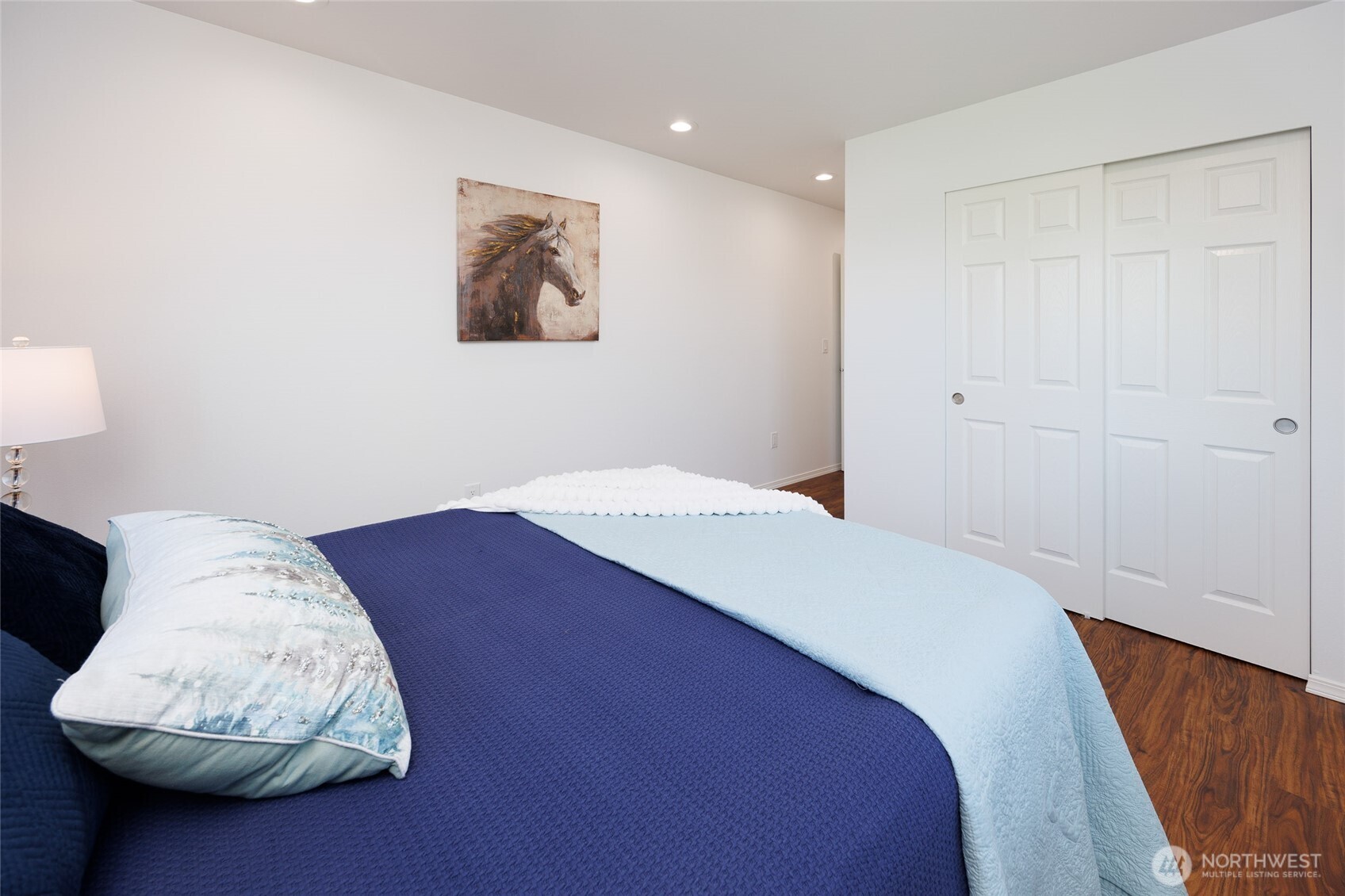 1708 Walnut Street Everett, WA 98201 - Photo 15 of 32 a bedroom with a bed and a chair