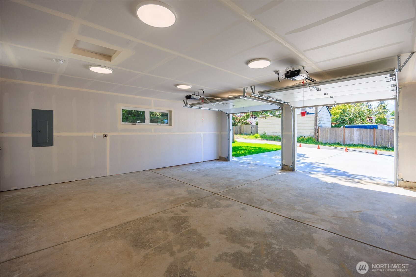 1708 Walnut Street Everett, WA 98201 - Photo 18 of 32 a view of an empty room with a window and a ceiling fan