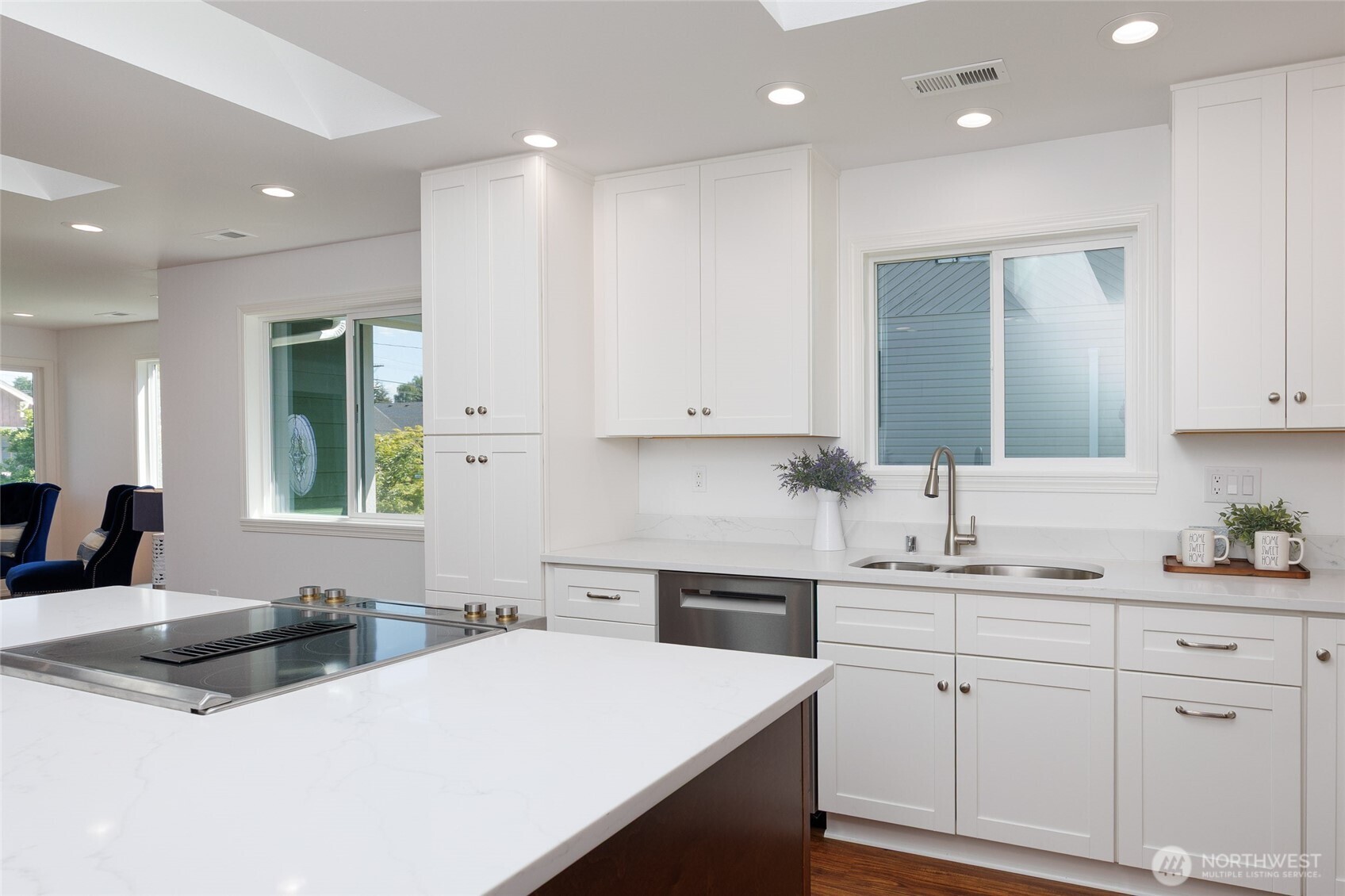 1708 Walnut Street Everett, WA 98201 - Photo 2 of 32 a kitchen with a sink a stove a refrigerator and white cabinets with wooden floor