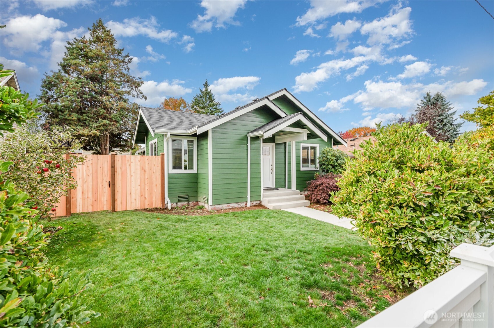 1708 Walnut Street Everett, WA 98201 - Photo 21 of 32 a front view of a house with a yard and garage
