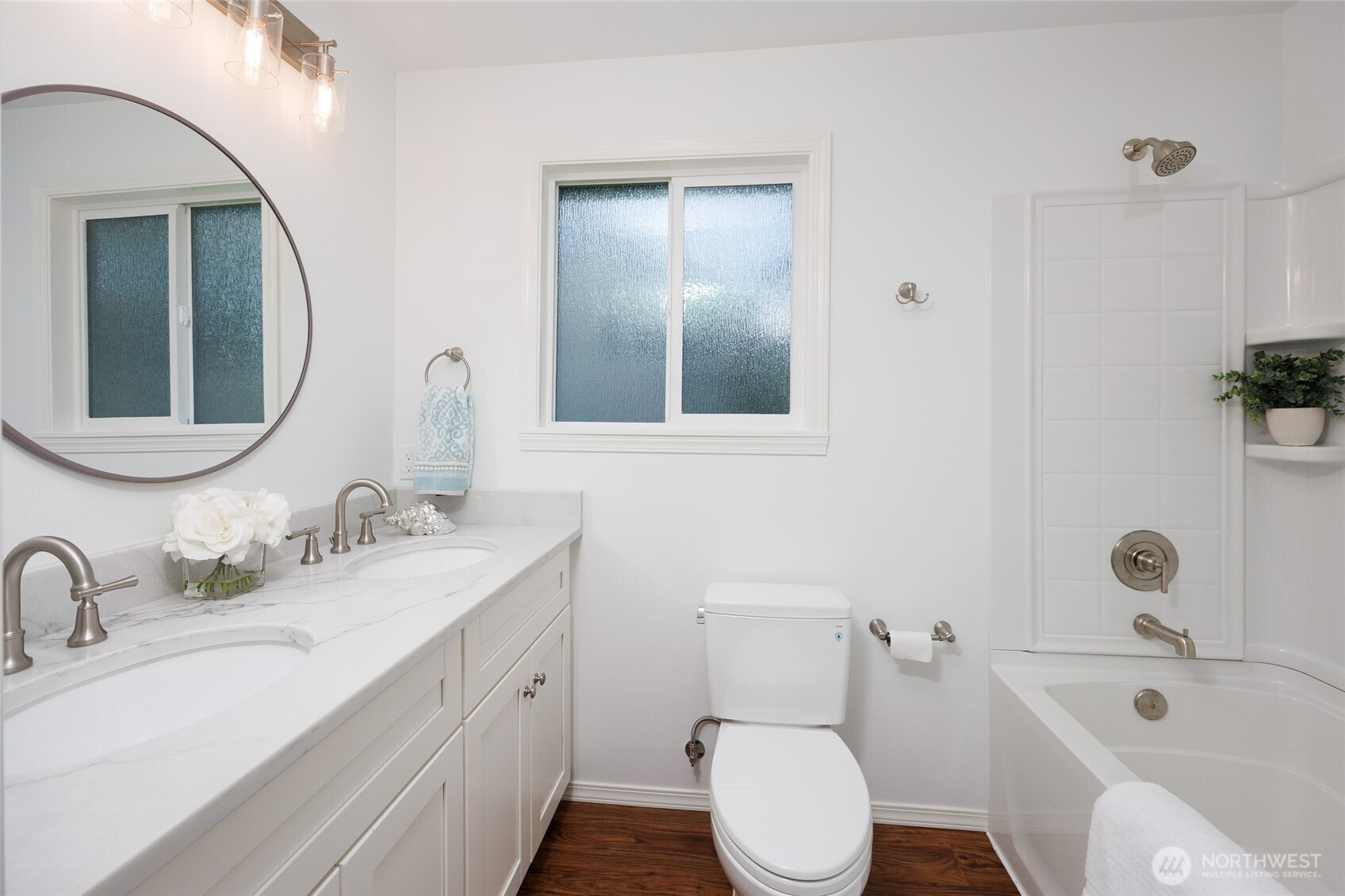 1708 Walnut Street Everett, WA 98201 - Photo 23 of 32 a bathroom with a toilet a sink a tub and mirror