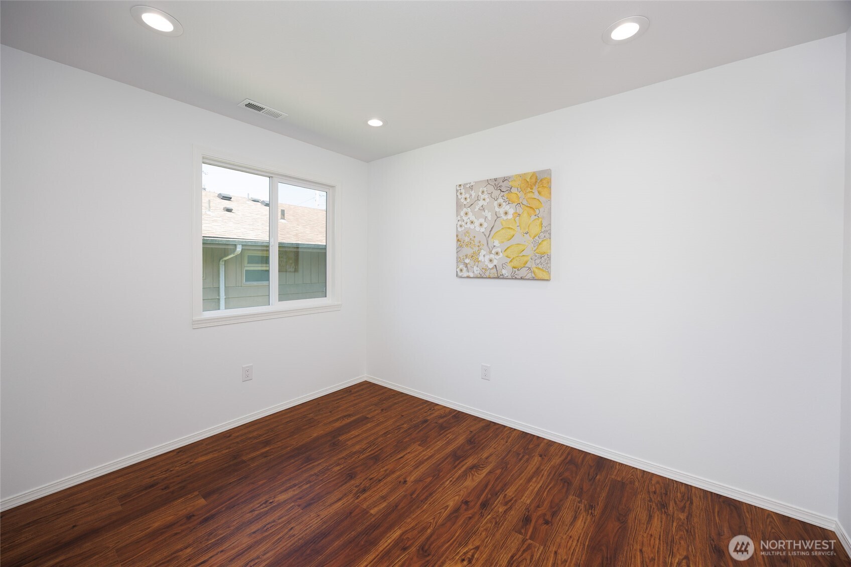 1708 Walnut Street Everett, WA 98201 - Photo 24 of 32 an empty room with wooden floor and windows