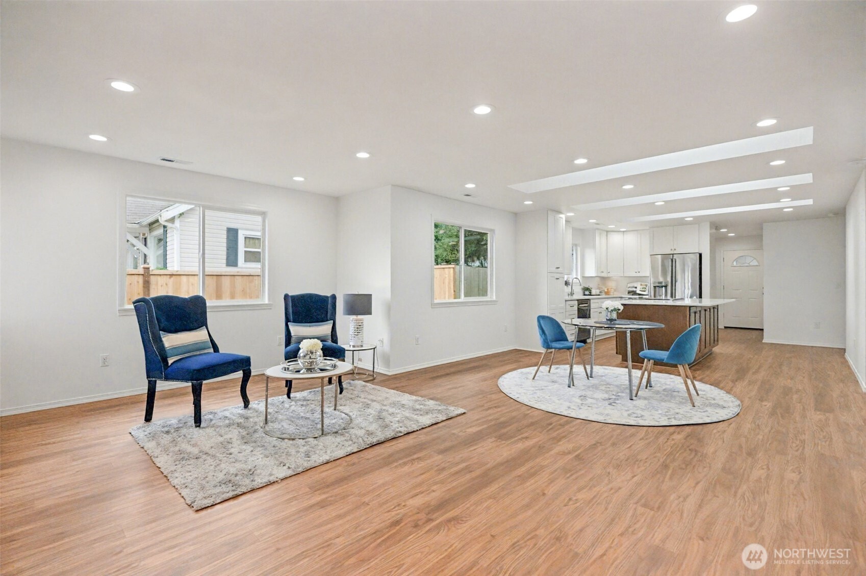 1708 Walnut Street Everett, WA 98201 - Photo 3 of 32 a living room with furniture and a dining table with wooden floor