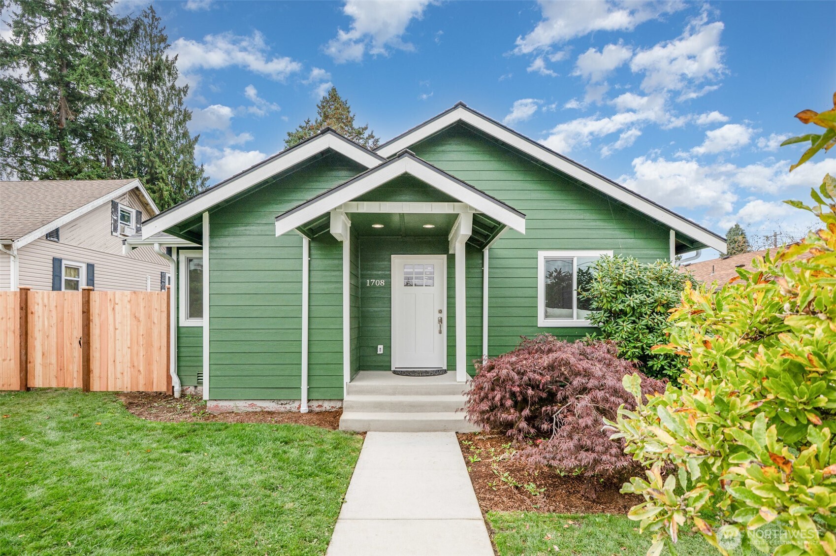 1708 Walnut Street Everett, WA 98201 - Photo 31 of 32 a front view of a house with a garden