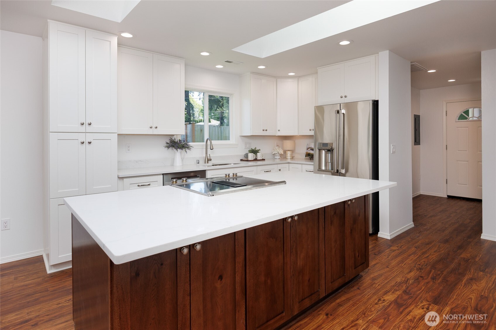 1708 Walnut Street Everett, WA 98201 - Photo 9 of 32 a kitchen with kitchen island sink refrigerator and cabinets