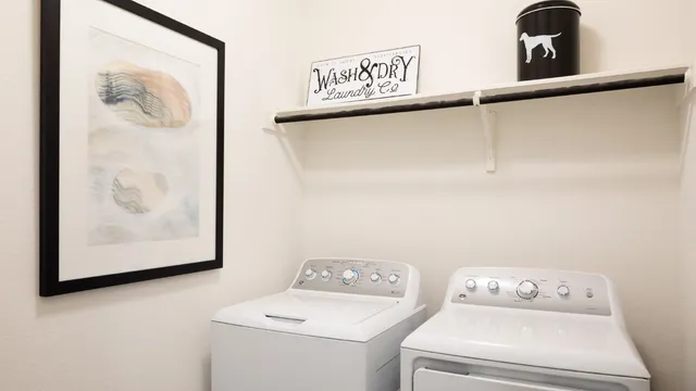 a utility room with dryer and washer