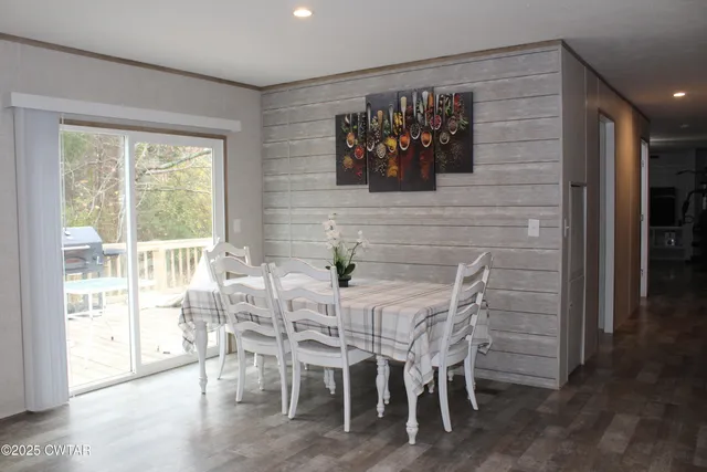 a view of a dining room with furniture window and outside view