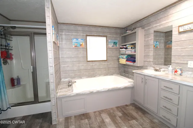 a bathroom with a bathtub and a sink