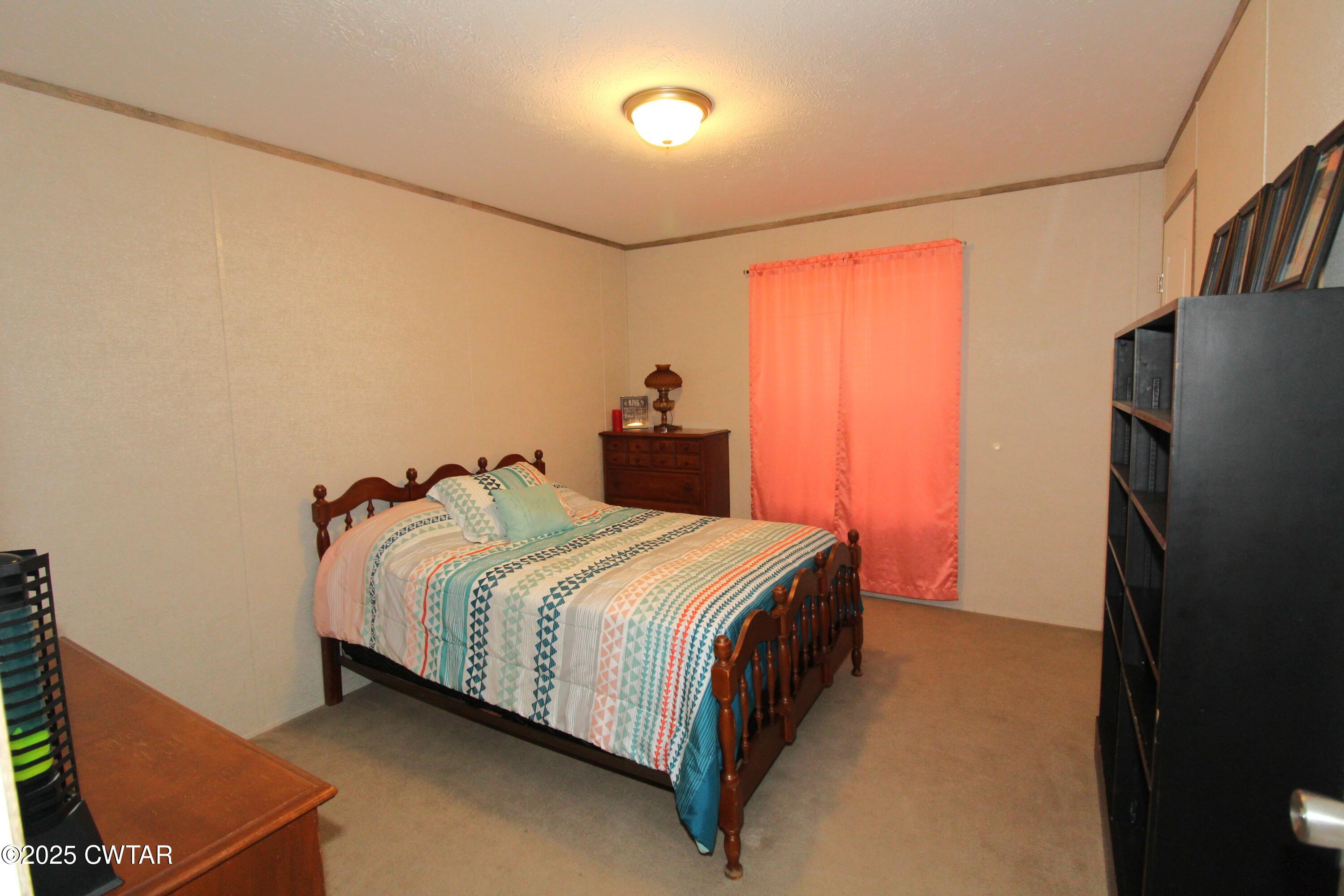 34 Rubin White Road Bradford, TN 38316 - Photo 29 of 35 a bedroom with a bed and a refrigerator