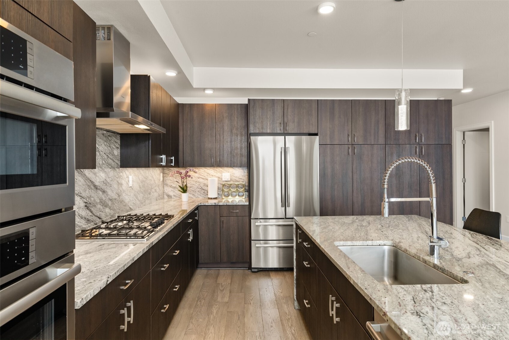 4961 Main Street, Unit 802 Tacoma, WA 98407 - Photo 14 of 39 a kitchen with stainless steel appliances granite countertop a sink stove and refrigerator