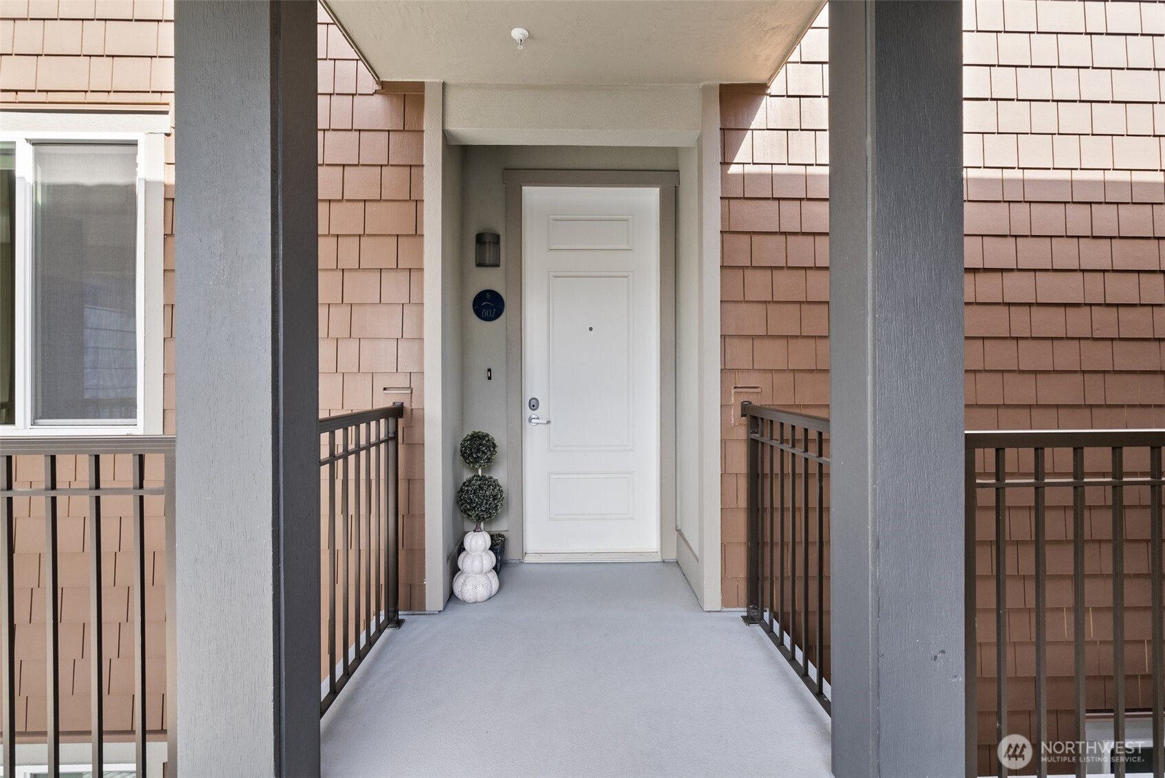 4961 Main Street, Unit 802 Tacoma, WA 98407 - Photo 2 of 39 a view of a hallway with a door
