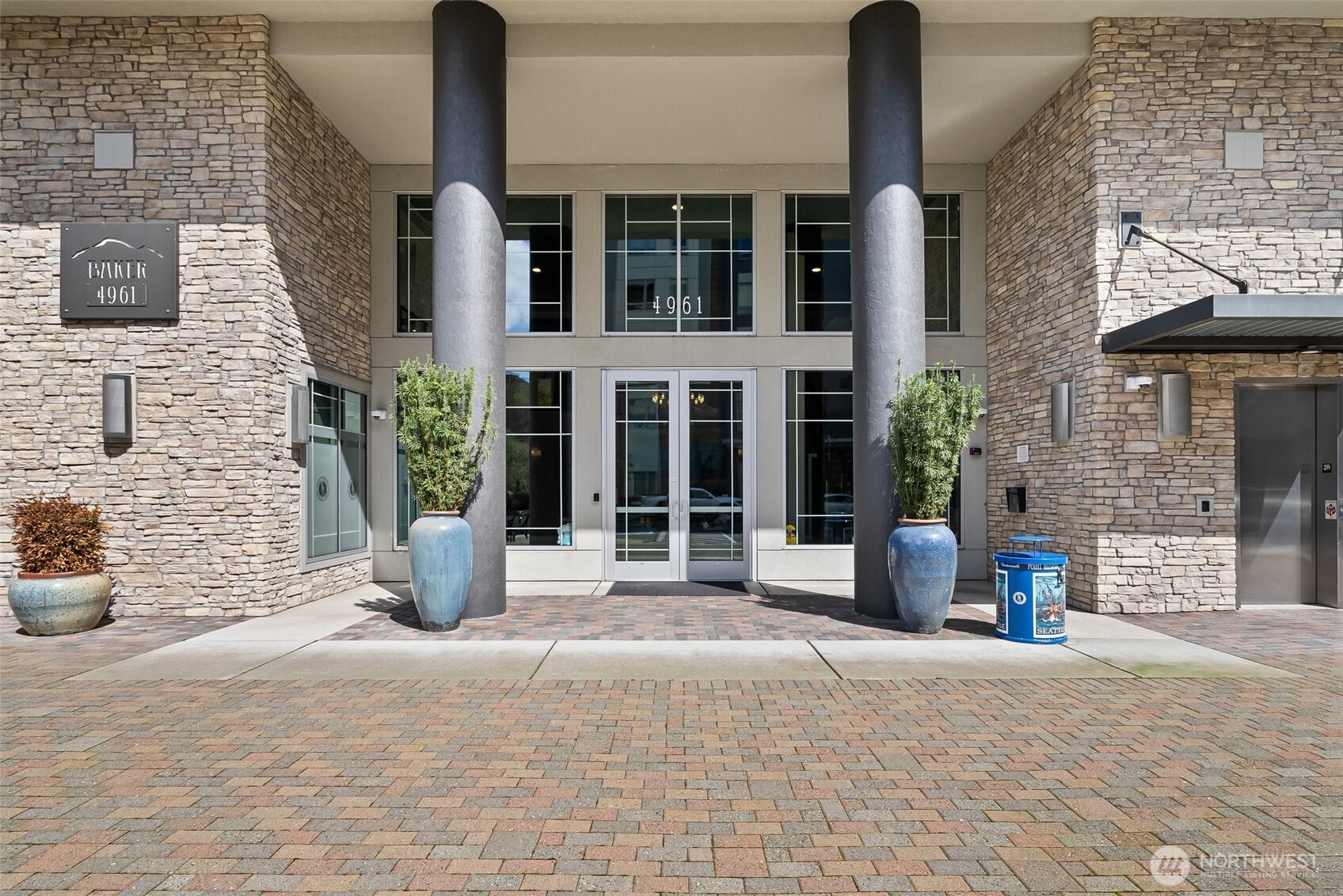 4961 Main Street, Unit 802 Tacoma, WA 98407 - Photo 29 of 39 a view of a brick building with many windows