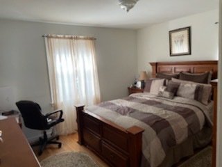 4264 West Nelson Street, Unit 2 Chicago, IL 60641 - Photo 5 of 7 a bedroom with a bed and a window