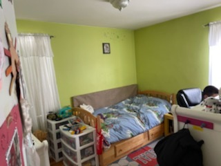 4264 West Nelson Street, Unit 2 Chicago, IL 60641 - Photo 6 of 7 a bedroom with a bed and a window