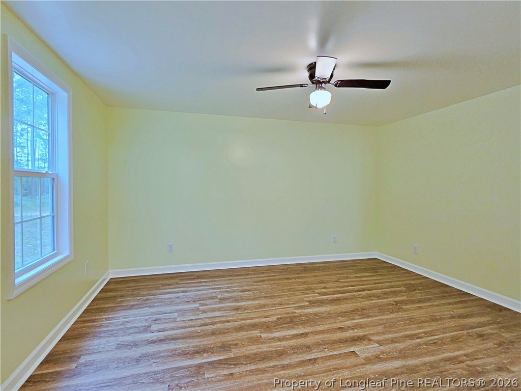 1031 Pine Acres Road White Oak, NC 28399 - Photo 16 of 29 wooden floor in an empty room with a window